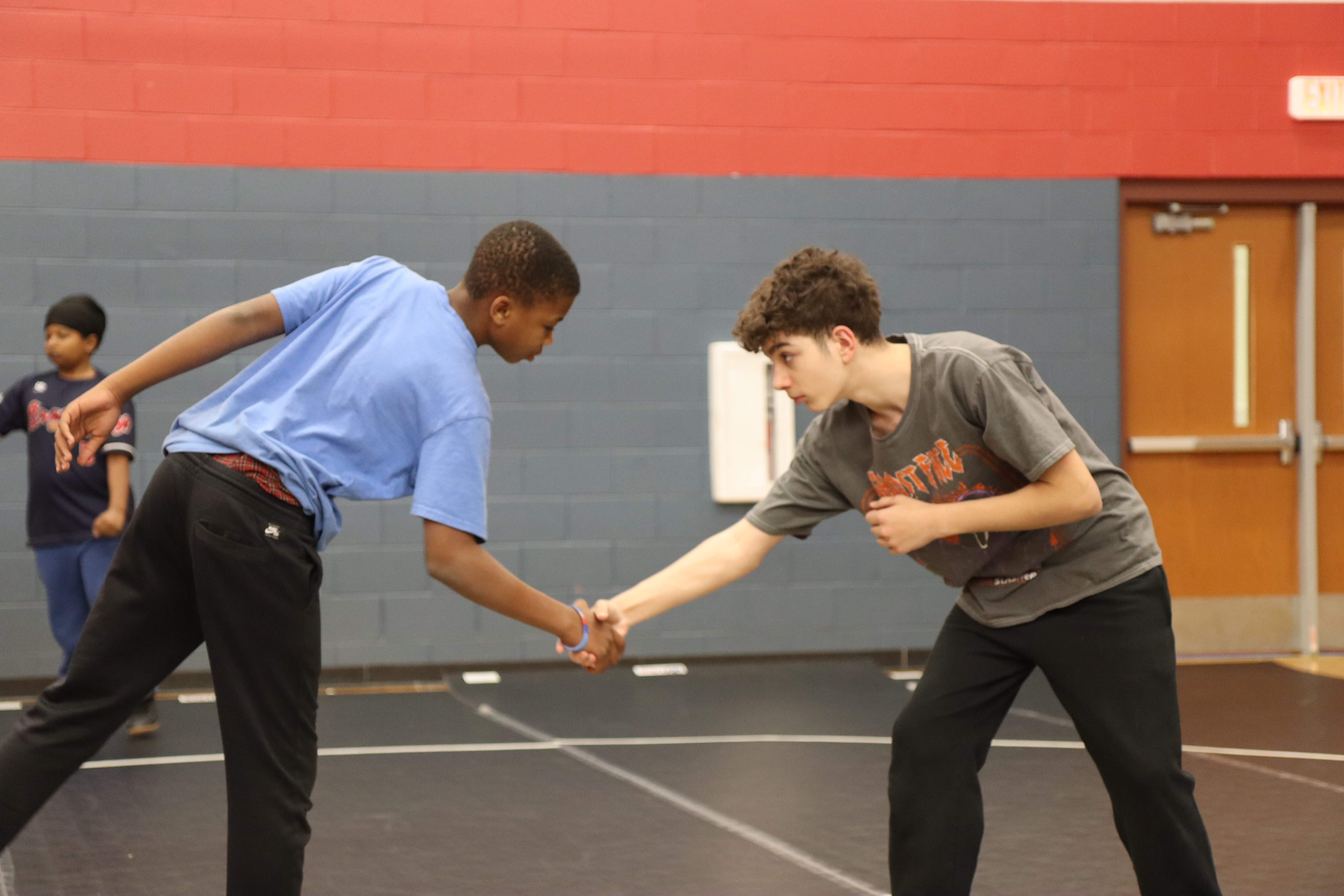 Coach instructing young athletes during practice